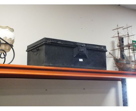 A BLACK PAINTED TIN TRUNK