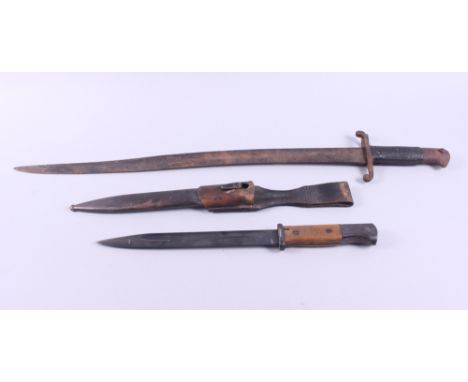 A French bayonet with curved blade, 22 1/2" long, and a bayonet with wooden handle and steel scabbard, blade 10" longConditio