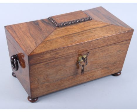 A 19th century rosewood tea caddy with wooden ring handles, on bun feet, 12 1/2" wide (damages)