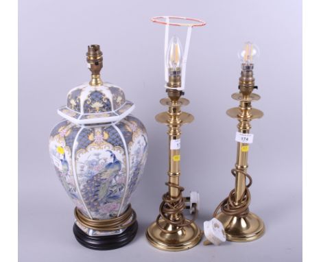 A pair of brass pillar table lamps and another table lamp, on Chinese vase base