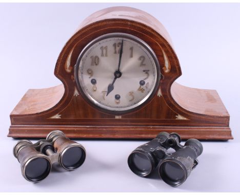 An early 20th century mantel clock, in mother-of-pearl inlaid mahogany "Napoleon's Hat" case, and two pairs of binoculars