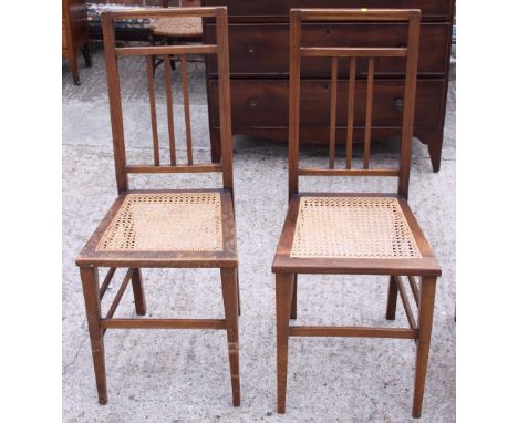 A pair of Edwardian cane seat bedroom chairs and an arch top towel rail