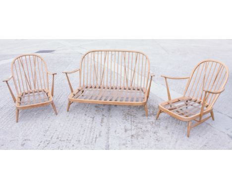 An Ercol spindle back three-piece suite with loose seat cushions