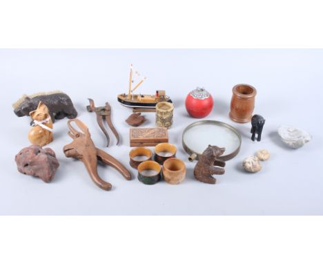 A nutcracker, in the form of a chamois, a model of a boat, a carved bear, a brush in the form of a bear, and various fossils,