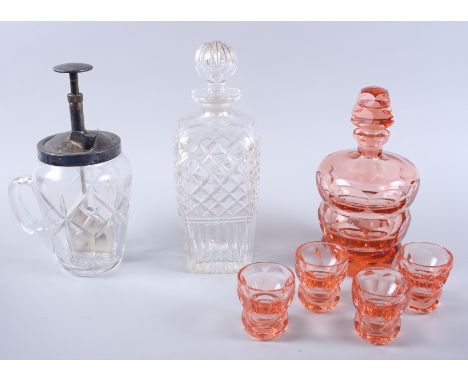 A tangerine glass decanter, four tots, a glass cocktail mixer jug with plated top and a clear glass decanter