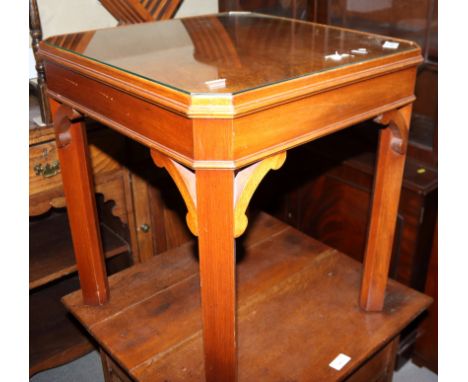 A set of three figured walnut lamp tables on chamfered supports, 18" square