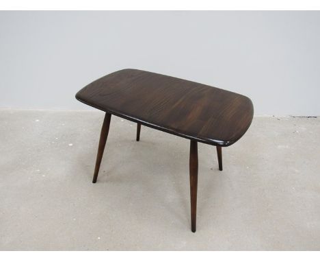 An Ercol lamp/small dark stained coffee table 
