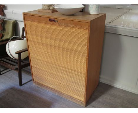 A Danish light oak tambour fronted office cabinet, fitted interior. 90cm x 46cm x 109.5cm