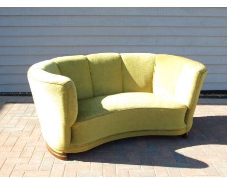 A 1940's Danish curved two seater sofa with original green velour upholstery. 160cm x 92cm x 73cm approx 