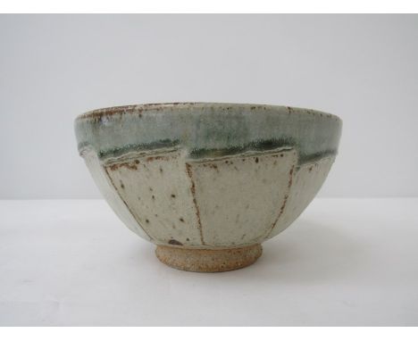 RICHARD BATTERHAM (b.1936): A studio pottery stoneware bowl with cut sides and pale green glaze. 9.5cm high x 18cm diameter