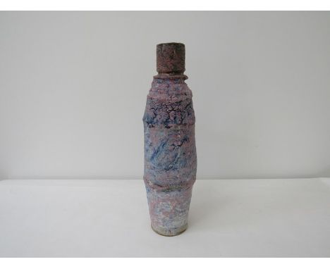 ROBIN WELCH (b.1936) (ARR) A studio pottery tall organic form vase with rough textured body, pink over blue glazes. Impressed