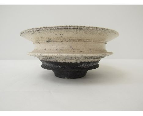 ROBIN WELCH (b.1936) A studio Raku pottery bowl with crackled whitish glaze and turquoise interior. Impressed mark. 8.5cm hig