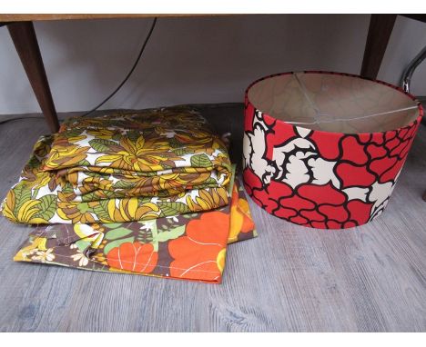 A large 1970s cotton printed tablecloth pair of vintage curtains and a retro light shade 