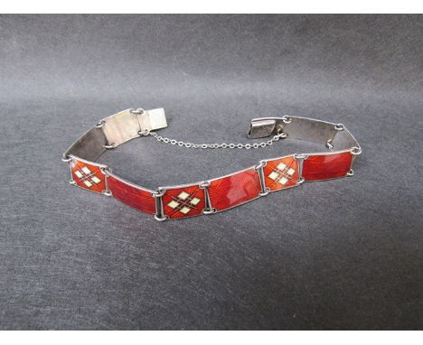 A Norwegian sterling and red enamel panel bracelet. Stamped Norge 925S verso