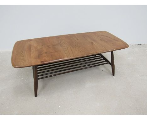 An Ercol coffee table with magazine shelf underneath 