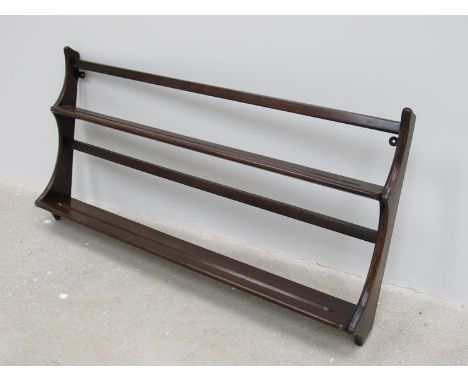 An Ercol dark beech wall shelf 