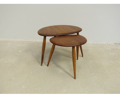 Two Ercol light elm pebble tables 