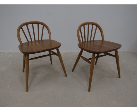 A pair of Ercol low back chairs 