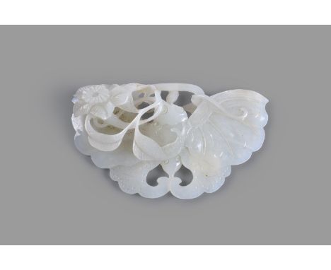 A Chinese white jade carving of a butterfly, late Qing Dynasty, resting on a floral branch, carved on both sides with incised