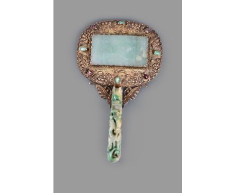 A Chinese Jadeite and silver-gilt hand mirror, Qing Dynasty, 19th century, the mirror is set into a silver-gilt frame impress