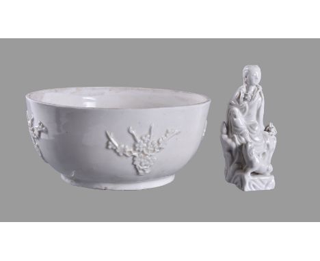 A Chinese Dehua ‘prunus’ bowl, 18th century, 21cm diameter; and a Chinese dehua statue of guanyin, 19th-20th century, 13cm hi