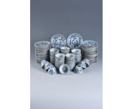 Sixty-Five Ca Mau 'bird and insect' pattern blue and white saucers and fifty-three tea bowls , circa 1725, with a central med