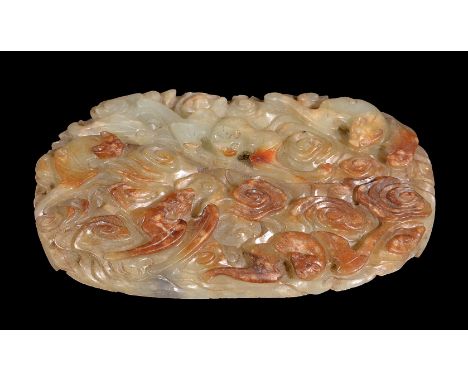 A Chinese celadon and russet jade ‘longevity’ belt plaque, Qing Dynasty, 18th century, the oval-shaped panel intricately carv