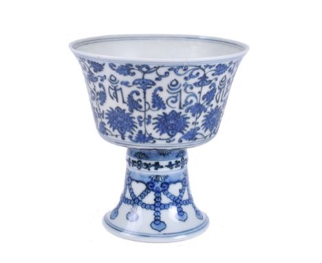 A Chinese blue and white stem cup, Qianlong seal mark and of the period, decoracted to the exterior below the flaring rim wit