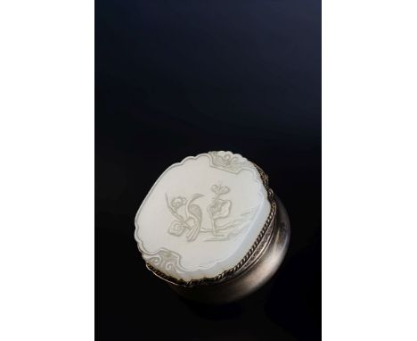 A Chinese white jade 'Happiness and Longevity' plaque, 18th century, Qing Dynasty, of quatrefoil form, one side elegantly car