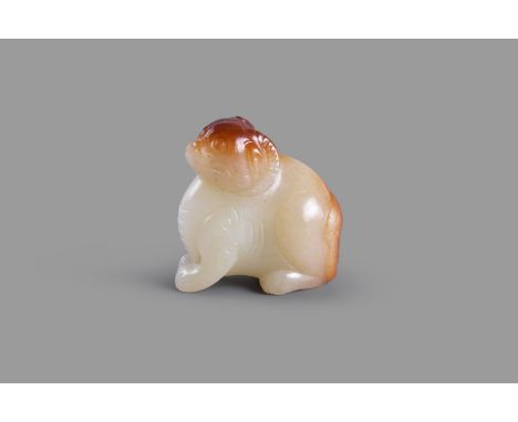 A white and russet jade carving of a mythical beast, probably Song-Ming Dynasty (960-1644), carved in the round as a mythical