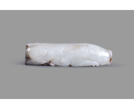 A Chinese pale and grey jade carving of a pig, carved in the round as a recumbent pig with a flat snout and pointed ears, dec