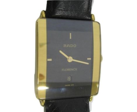 Gents Rado Florence Evening Watch with curved glass face, gold bands to each side, baton markers to compass points, date aper