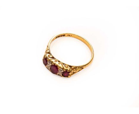 An 18 carat gold ruby and diamond ring, finger size Q1/2Condition report: Gross weight 4.3 grams.
