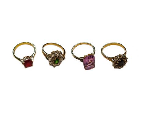 A 9 carat gold amethyst and diamond ring, finger size N1/2; an 18 carat gold synthetic ruby ring, finger size N; and two furt