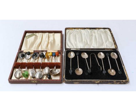 A collection of assorted silver flatware, including: assorted coffee-spoons with finials carved as coffee beans, in associate