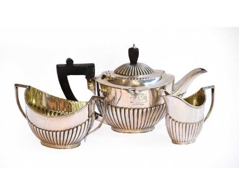 A Three-Piece Victorian Silver Tea-Service, by William Gibson and John Lawrence Langman, Sheffield, 1883, each piece tapering