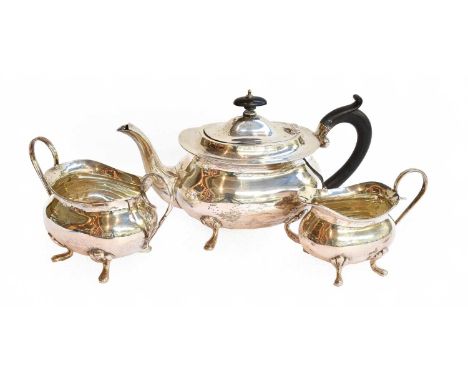 A George VI Silver Three-Piece Silver Tea-Service, by Joseph Gloster, Birmingham, 1945, each piece on four pad feet, gross we