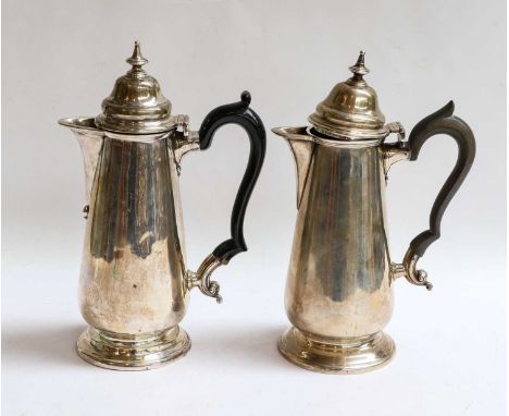 An Edward VII Silver Hot-Water Jug and a George V Silver Hot-Water Jug, by the Goldsmiths and Silversmiths Co. Ltd., London, 