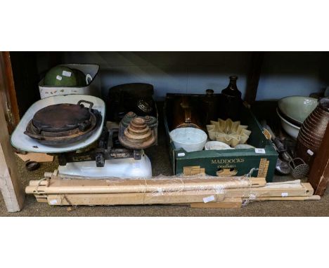 A quantity of kitchenalia including a set of enamel scales and weights, cast iron waffle press, stoneware jelly moulds, ename