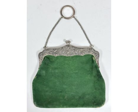 An Edwardian Art Nouveau Birmingham silver mounted green suede bag, with original watered green silk lined interior and chase