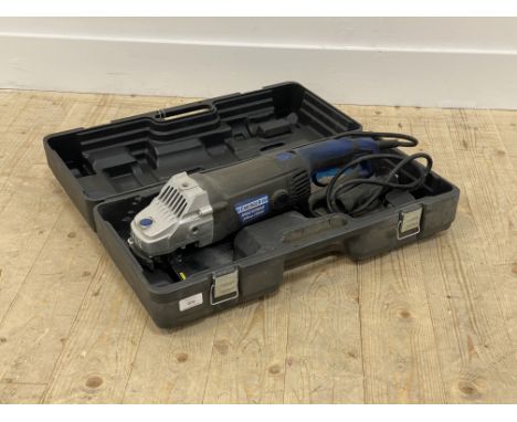 An Energer 230mm corded angle grinder, complete with hard case and six cutting disks