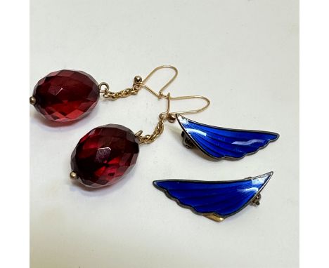 A pair of red amber coloured oval faceted drop earrings, (2cm) and a pair of Norwegian A SCH sterling silver gilt dark blue g