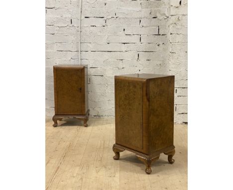 A pair of burr walnut bedside cabinets, circa 1930's, each with single door enclosing a shelf, raised on cabriole supports H7