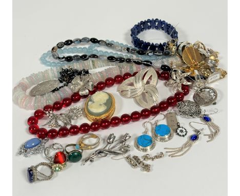 A collection of costume jewellery, including agate bead necklaces, bracelet, silver brooches, turquoise disc earrings, mounts