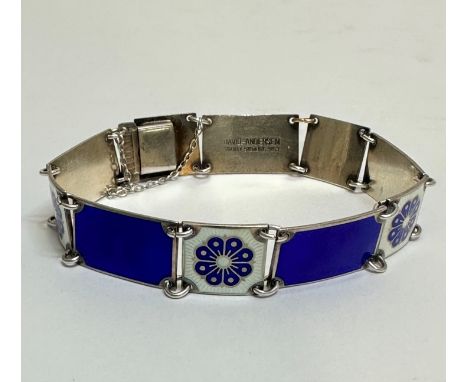 A Norwegian David Andersen silver panel articulated bracelet, set five dark blue guilloche enamel panels inter-spaced with sq