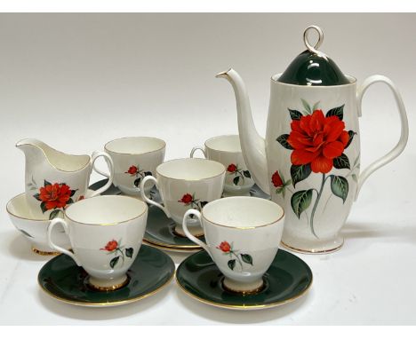 A Royal Albert 'Tahiti' part coffee set decorated with flowers and gilt comprising a coffee pot (h- 24cm, w- 21cm), a milk ju