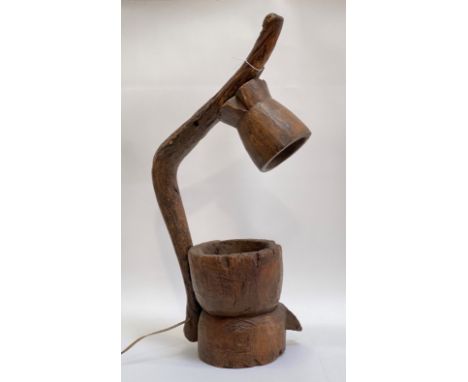 An unusual table lamp formed from and African carved wooden mortars. H75cm