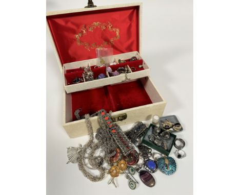 A white jewellery box containing a collection of costume jewellery including white metal chain necklaces, hardstone and ename