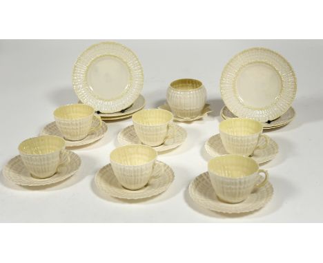 A Belleek Irish porcelain twisted shell tea service comprising six saucers, six tea cups, a sugar pot (h-7.5cm), a star shape