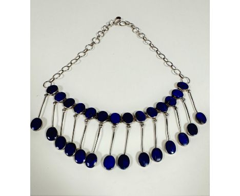 An Afghanistan white metal chain necklace set fourteen lapis lazuli oval hinged stones with suspension thong style lapis lazu